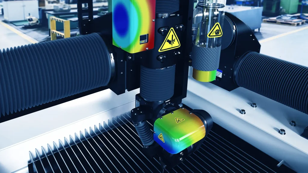 CNC Machine with FEA structural analysis overlaid by SOLIDWORKS Simulation software.